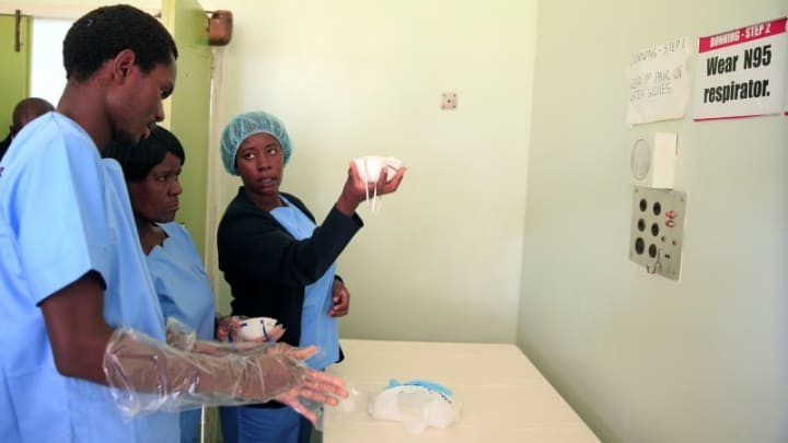 Health worker at a hospital in Harare, Zimbabwe, participate in a training exercise to prepare them for potential COVID-19 cases