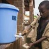 Opinion: Education in the time of COVID-19 COVID19_Boy washing hands Guinea