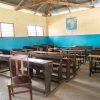 COVID-19 school closures may further widen the inequality gaps between the advantaged and the disadvantaged in Ethiopia simple class room in village school with wooden desks and chairs in Zanzibar, Africa