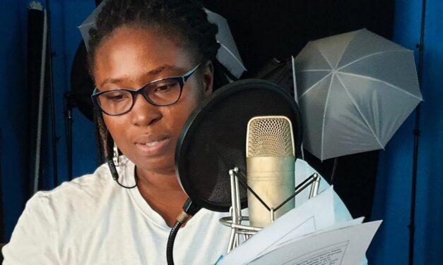 Woman in Sound studio recording a lesson in Sierra Leone