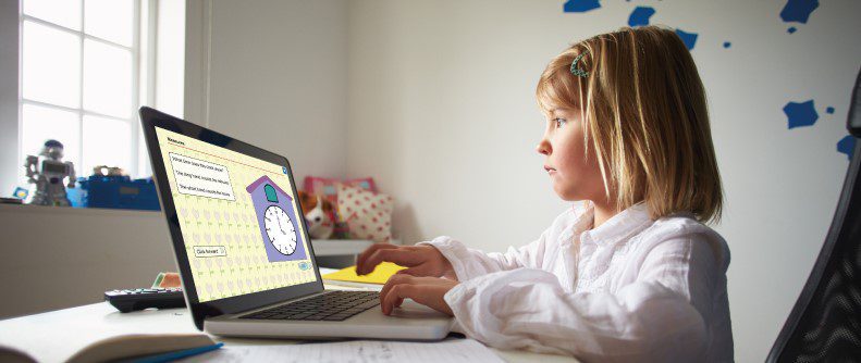 girl working on a educational page with a clock via a laptop