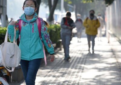 People walking in the street with facemasks