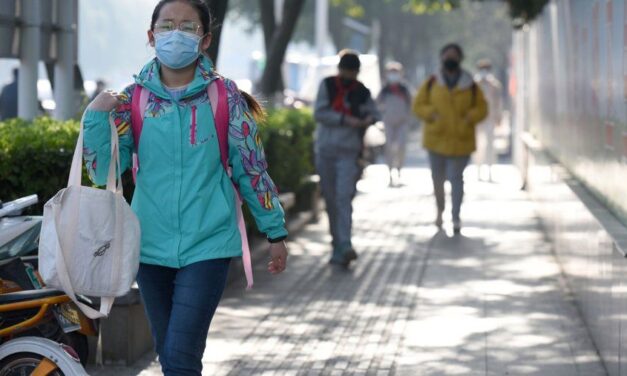 People walking in the street with facemasks