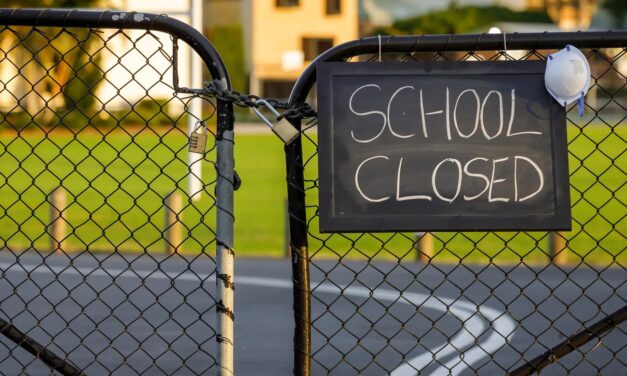 Locked gates with School Closed notice