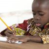 Education response to COVID-19: How can basic education be implemented in Ethiopia? Adorable Little African Child Writing at School in Bamako, Mali
