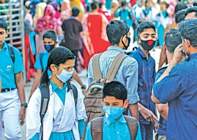 A group of people the majority wearing face masks