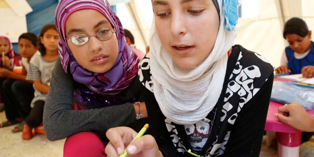 Two girls in  Lebanon tackling a maths question