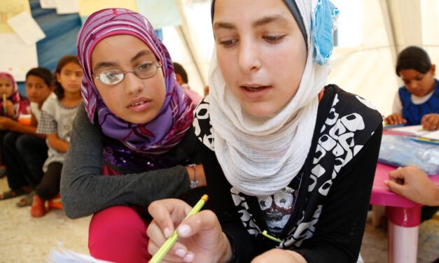Two girls in  Lebanon tackling a maths question