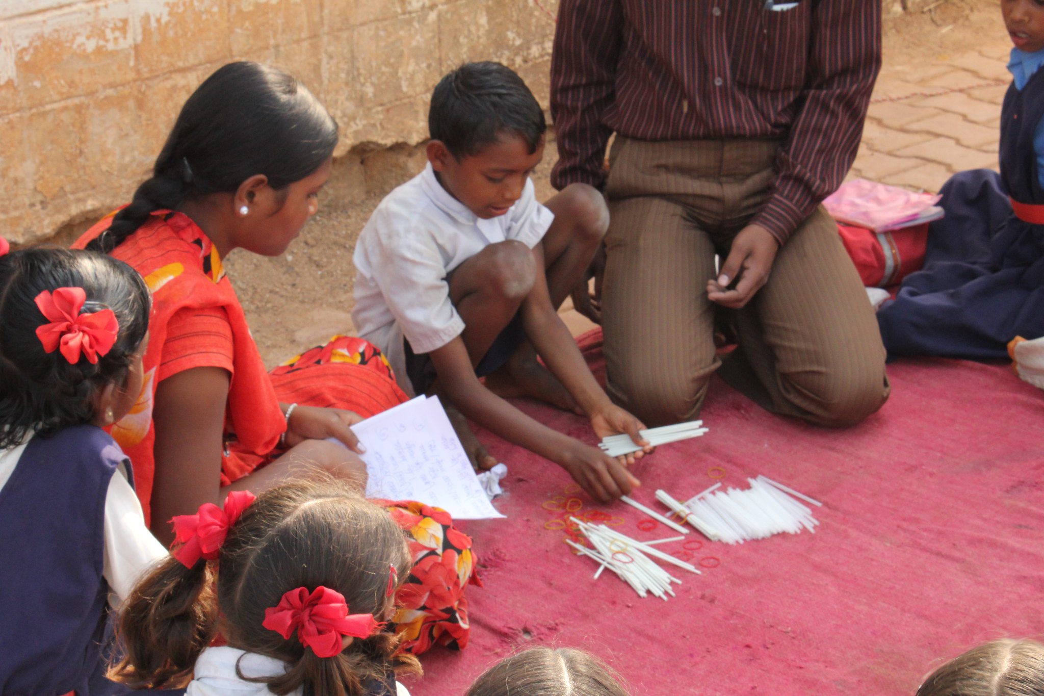 Teacher and students in outdoor lesson