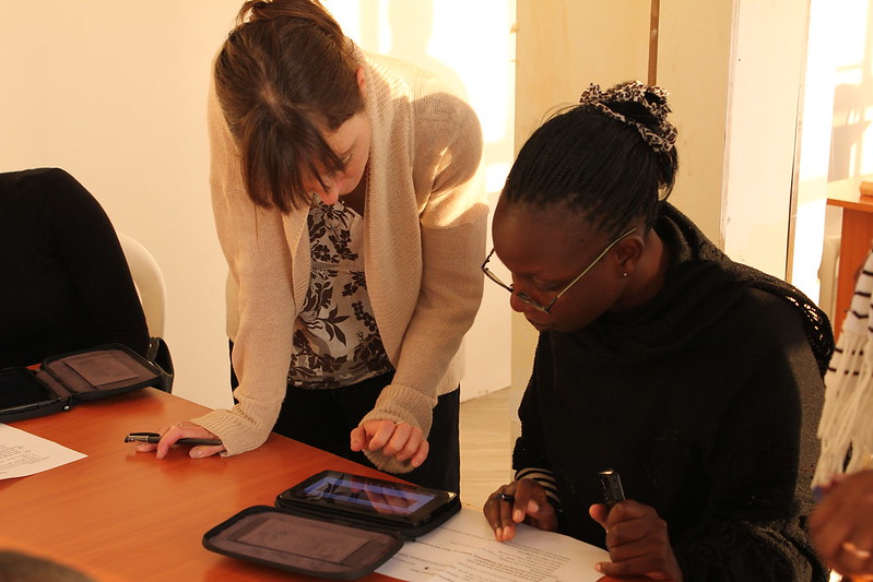 Two adults looking at a tablet computer