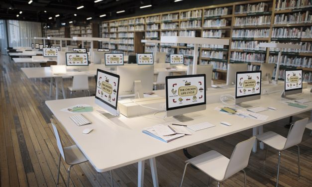 Computer screens as learning stations set up in library setting