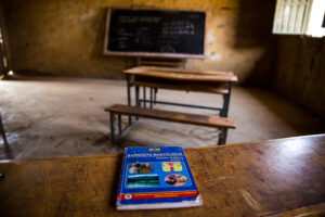 Ethiopian school empty classroom and desk with textbook 