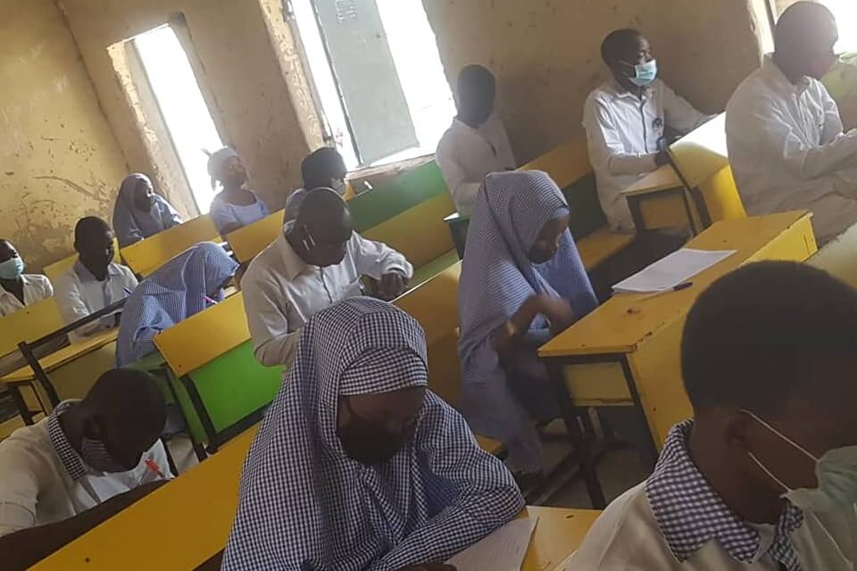 Class in Nigeria with students wearing masks