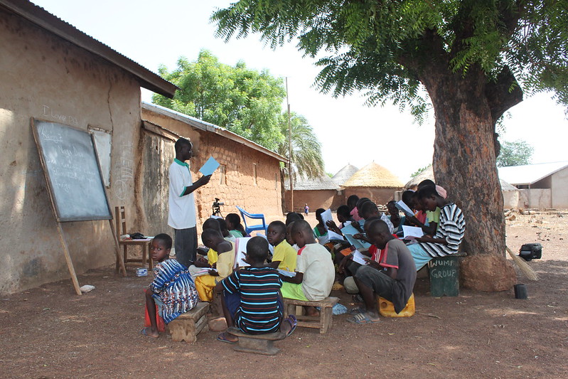 Children being taught in an outdoor classroom in northern Ghana