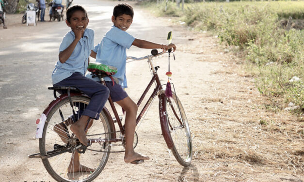 School boys on a bike in Hampi, India.