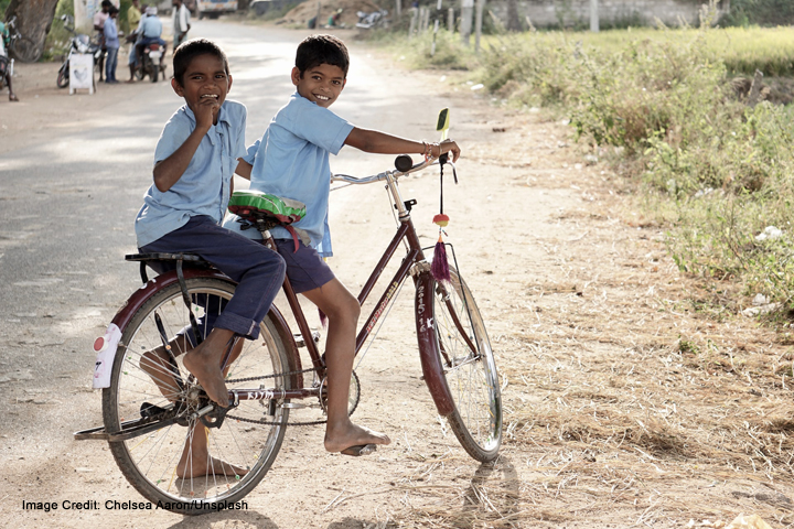 School boys on a bike in Hampi, India.