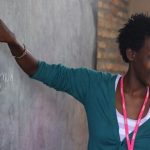 Teacher pointing to chalkboard