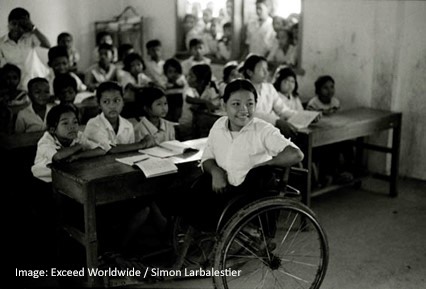 classroom scene with child in wheelchair