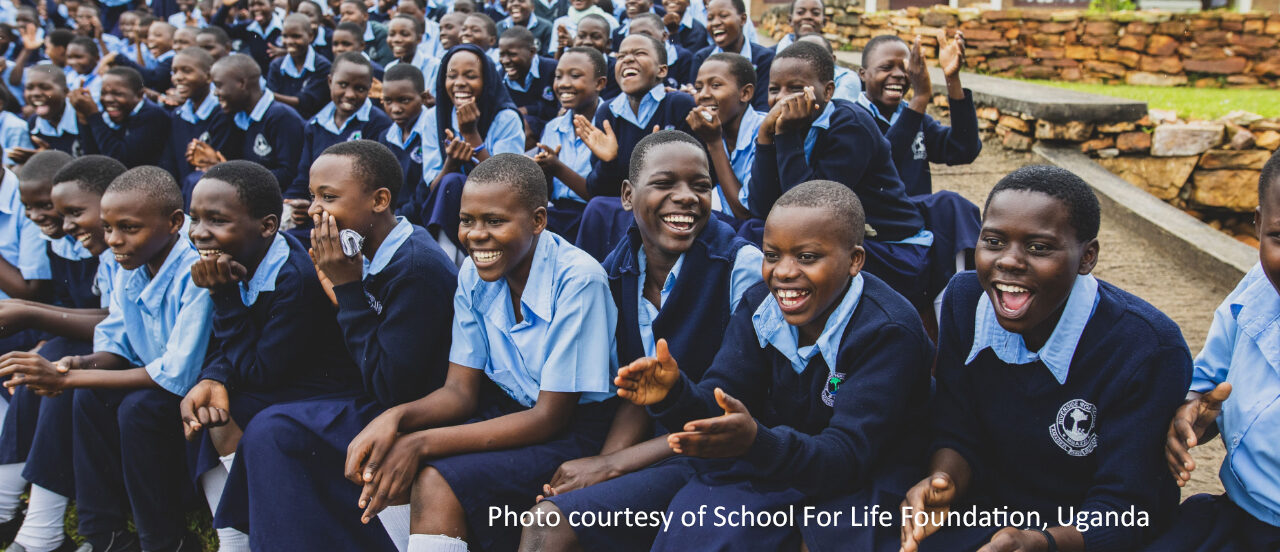 Group of smiling Ugandan school children