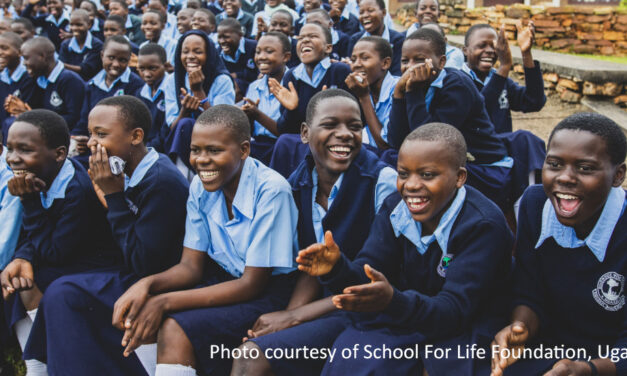 Group of smiling Ugandan school children