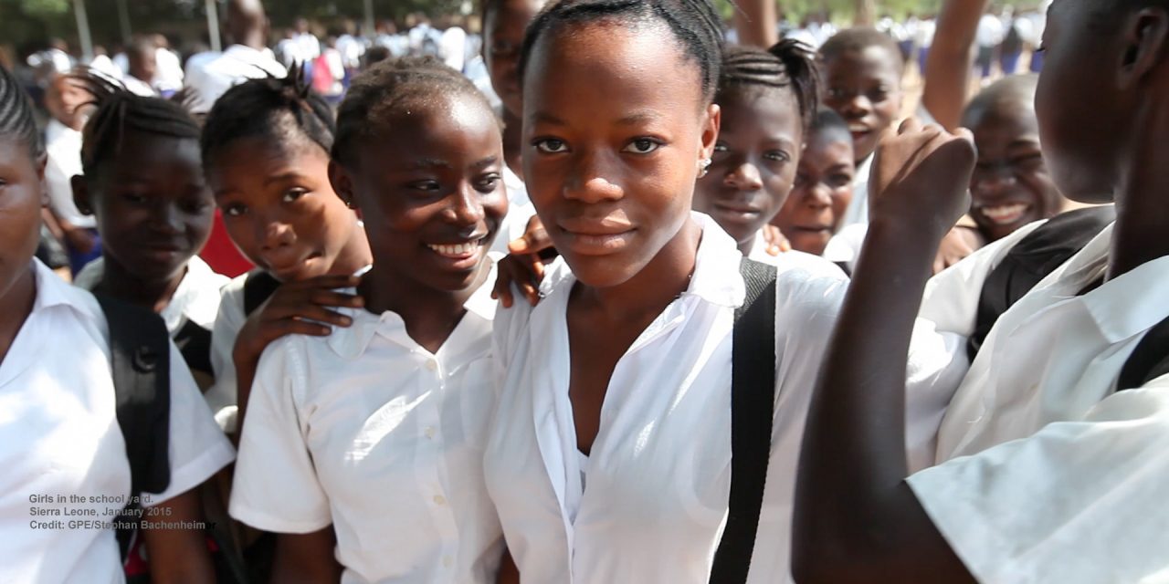 A group of teenage African school children in school uniform