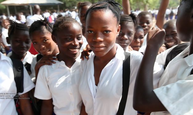 A group of teenage African school children in school uniform