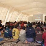 Chiildren in temporary classroom in a refugee camp