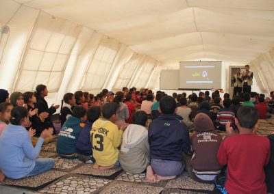 Chiildren in temporary classroom in a refugee camp