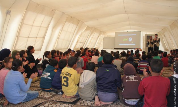 Chiildren in temporary classroom in a refugee camp