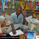 Boy doing school work listening to the radio
