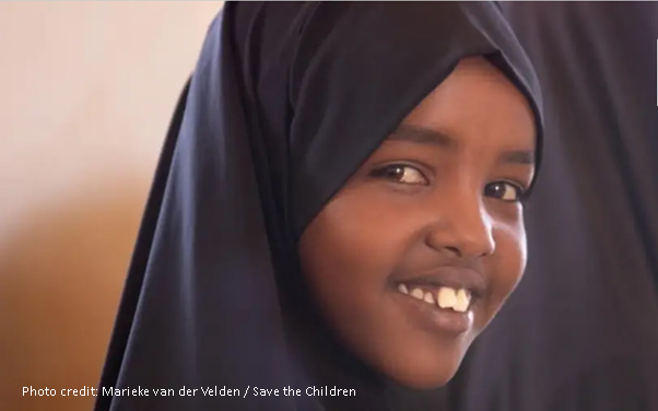 smiling girl wearing a headscarf