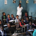 Primary school teacher in her class
