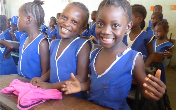 smiling girls in a classroom in Sierra Leone