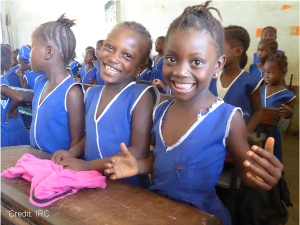 smiling girls in a classroom in Sierra Leone