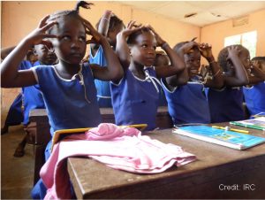 children doing mindfulness exercises in Sierra Leone classroom