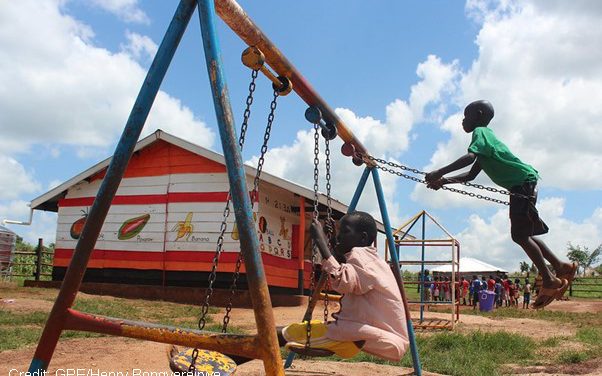 children play in the playground of their pre-school, Uganda.
