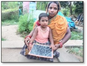 Mother with sitting with child on her knee with a small blackboard