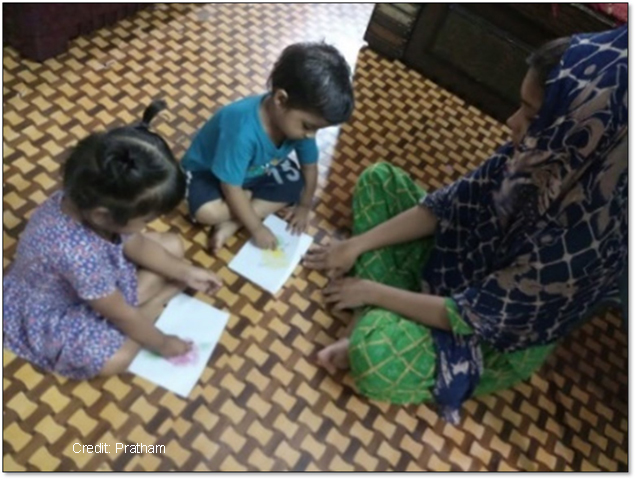 Mother playing with children at home