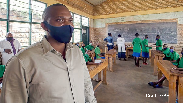 School representative wearing a face mask in the classroom, Rwanda 2021.
