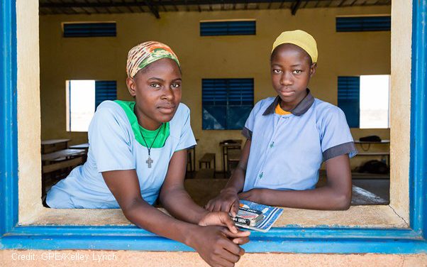 Two teenage girls at their classroom window, Niger.