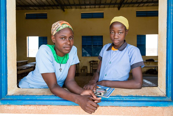 Two teenage girls at their classroom window, Niger.