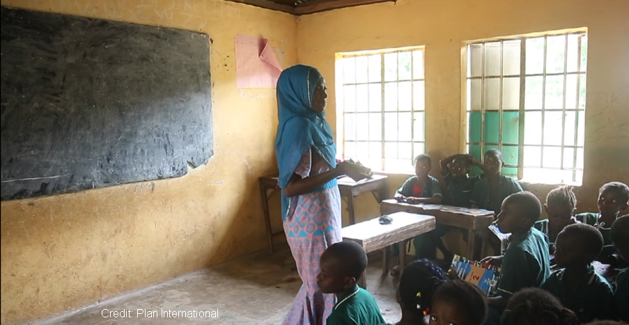 Female teacher at the head of the classroom, Sierra Leone