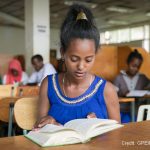 Girl reads in the library at a special needs school, Oromia, Ethiopia