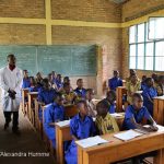 A teacher in a class of boys in Rwanda