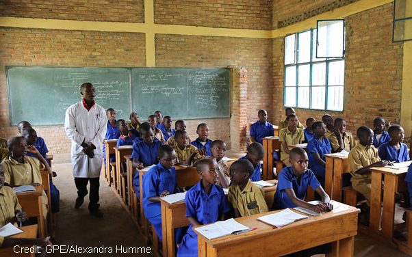 A teacher in a class of boys in Rwanda