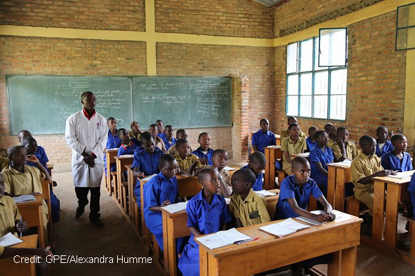 A teacher in a class of boys in Rwanda