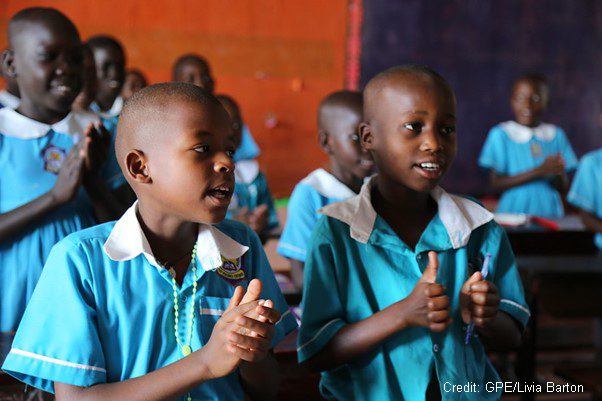 Children singing in the classroom of a primary school, Uganda