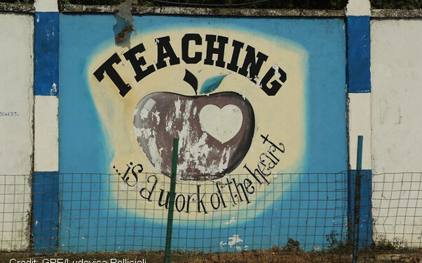 Sign reading ‘Teaching is a work of the heart’ on the wall of Freetown Teacher’s College, Sierra Leone.