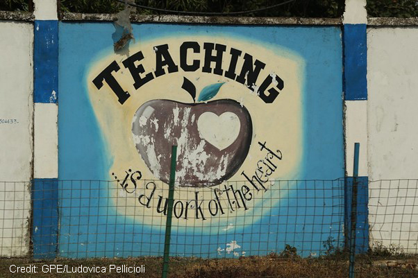 Sign reading ‘Teaching is a work of the heart’ on the wall of Freetown Teacher’s College, Sierra Leone.