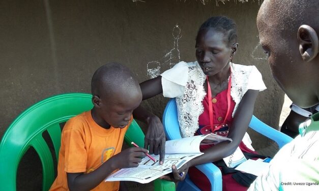 South Sudanese volunteers assess a child's reading